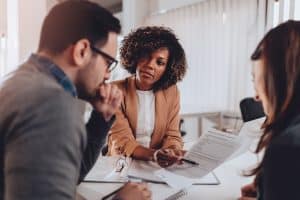 Couple preparing to sign a contract of sale